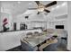This dining room has bright lighting, a glass table, and seating for six at 174 Buena Ct, Henderson, NV 89074