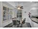 The dining room provides plenty of natural light and a modern table with seating at 174 Buena Ct, Henderson, NV 89074