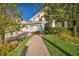 Inviting two-story home with a three-car garage and beautifully landscaped front yard at 174 Buena Ct, Henderson, NV 89074