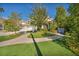 Inviting two-story home with a three-car garage and beautifully landscaped front yard at 174 Buena Ct, Henderson, NV 89074
