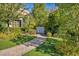 Well-manicured front yard with lush greenery, brick pathway, and charming shrubbery at 174 Buena Ct, Henderson, NV 89074