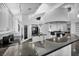 This kitchen is equipped with modern appliances, granite countertops, and ample lighting at 174 Buena Ct, Henderson, NV 89074