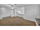 Well-lit open loft features neutral carpet and bright white walls at 174 Buena Ct, Henderson, NV 89074