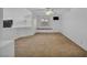 Spacious loft area with neutral carpet, a window bench, and bright white walls at 174 Buena Ct, Henderson, NV 89074