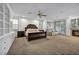 Spacious main bedroom featuring a fireplace, sitting area, carpet flooring, and custom built-in cabinetry at 174 Buena Ct, Henderson, NV 89074