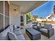 Covered patio with comfortable outdoor seating overlooking the private pool and yard at 174 Buena Ct, Henderson, NV 89074