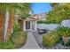 Charming patio with outdoor seating, lush greenery, and beautiful landscaping for relaxing and entertaining at 174 Buena Ct, Henderson, NV 89074