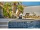 Close up view of a relaxing pool with a beautiful water feature and cozy seating area for lounging at 174 Buena Ct, Henderson, NV 89074