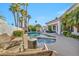 Beautiful backyard pool with a spa and lush landscaping is perfect for outdoor entertaining at 174 Buena Ct, Henderson, NV 89074