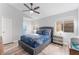 Comfortable bedroom with ceiling fan, neutral walls, and natural light, offering a relaxing atmosphere at 1999 Dry Falls St, Las Vegas, NV 89142