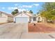 Charming single-story home with a well-maintained yard, driveway, and attached garage at 1999 Dry Falls St, Las Vegas, NV 89142