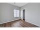 This bedroom is well-lit with wood floors and a closet, offering ample space at 2517 New Salem Ave, Henderson, NV 89052