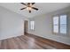 Bedroom featuring hardwood floors, ceiling fan, and walk-in closet at 2517 New Salem Ave, Henderson, NV 89052