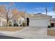 Welcoming single-story home showcasing a two-car garage, framed by drought-resistant landscaping at 2517 New Salem Ave, Henderson, NV 89052