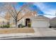 Charming single-story home featuring a two-car garage, complemented by a well-maintained, low-water landscape at 2517 New Salem Ave, Henderson, NV 89052