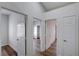 Hallway featuring several white interior doors leading to bedrooms and bathrooms at 2517 New Salem Ave, Henderson, NV 89052