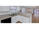Modern kitchen featuring granite countertops, white cabinets, modern appliances and breakfast bar at 2517 New Salem Ave, Henderson, NV 89052