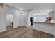 Inviting living space showcases new floors, with a view of the kitchen, laundry, and front door at 2517 New Salem Ave, Henderson, NV 89052