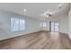 Bright living room boasts new floors, recessed lighting, and a sliding door to the backyard at 2517 New Salem Ave, Henderson, NV 89052