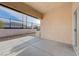 Enclosed patio featuring a concrete slab, stucco wall, and view of the yard at 2517 New Salem Ave, Henderson, NV 89052
