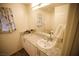 Bathroom featuring granite counters, updated mirror, and modern faucet at 2946 Plum Torte St, Las Vegas, NV 89122