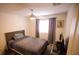 Bedroom with a ceiling fan, a window, and a TV at 2946 Plum Torte St, Las Vegas, NV 89122