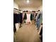Walk-in closet featuring carpeted floor and a spacious layout for organizing clothes and accessories at 2946 Plum Torte St, Las Vegas, NV 89122