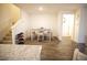 Bright dining area featuring a four-chair table and shoe storage at 2946 Plum Torte St, Las Vegas, NV 89122