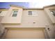 Modern townhome showcasing a clean architectural design with large windows and a two-car garage at 2946 Plum Torte St, Las Vegas, NV 89122