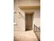 Tan front door of home featuring a paved entrance and a black railing at 2946 Plum Torte St, Las Vegas, NV 89122