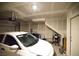 Bright garage featuring a car, drywall, and garage door mechanism at 2946 Plum Torte St, Las Vegas, NV 89122