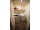 Laundry room featuring a full-sized washer, dryer, and storage shelf at 2946 Plum Torte St, Las Vegas, NV 89122