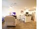 Living room with kitchen, bar seating, and stainless steel appliances at 2946 Plum Torte St, Las Vegas, NV 89122
