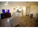 Cozy living space featuring a TV, kitchen island, and shoe storage at 2946 Plum Torte St, Las Vegas, NV 89122
