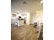 Modern open-concept living space with island seating and stainless steel appliances at 2946 Plum Torte St, Las Vegas, NV 89122