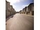Quiet residential street lined with modern townhomes, offering a sense of community and convenient living at 2946 Plum Torte St, Las Vegas, NV 89122