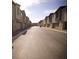 Quiet residential street lined with modern townhomes, offering a sense of community and convenient living at 2946 Plum Torte St, Las Vegas, NV 89122