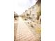 Charming townhomes with individual entrances and landscaped walkways, creating a welcoming community atmosphere at 2946 Plum Torte St, Las Vegas, NV 89122