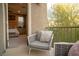 Inviting balcony with woven seating overlooking the bedroom; great for relaxing and enjoying outdoor views at 343 Cadence Vista Dr, Henderson, NV 89011