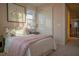 Charming bedroom featuring a comfortable bed, closet and soft, natural light from a window at 343 Cadence Vista Dr, Henderson, NV 89011