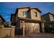 Inviting two-story home featuring stone details and a spacious two-car garage, creating a warm curb appeal at 343 Cadence Vista Dr, Henderson, NV 89011