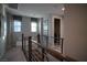 Upstairs hallway featuring cozy window seating and modern railing at 343 Cadence Vista Dr, Henderson, NV 89011