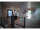 Bright hallway showcasing a modern railing and accent wall art at 343 Cadence Vista Dr, Henderson, NV 89011