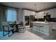 Eat-in kitchen features stainless appliances, ample counter space, and a cozy dining area with natural light at 343 Cadence Vista Dr, Henderson, NV 89011