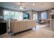 Spacious open-concept living area featuring stylish furniture, abundant natural light, and seamless flow to the dining area at 343 Cadence Vista Dr, Henderson, NV 89011