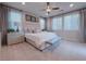 Cozy main bedroom featuring a upholstered bed and three windows at 343 Cadence Vista Dr, Henderson, NV 89011