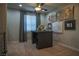 Bright, carpeted office space with ceiling fan and wall art at 343 Cadence Vista Dr, Henderson, NV 89011