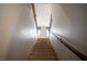 Carpeted staircase with modern railing leading to the upper level of the home at 343 Cadence Vista Dr, Henderson, NV 89011