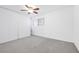 Carpeted bedroom featuring a ceiling fan, window, and large closet at 4216 Sawyer Ave, Las Vegas, NV 89108