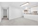 Bright living room featuring neutral walls and plush carpeting in an open concept design at 4216 Sawyer Ave, Las Vegas, NV 89108